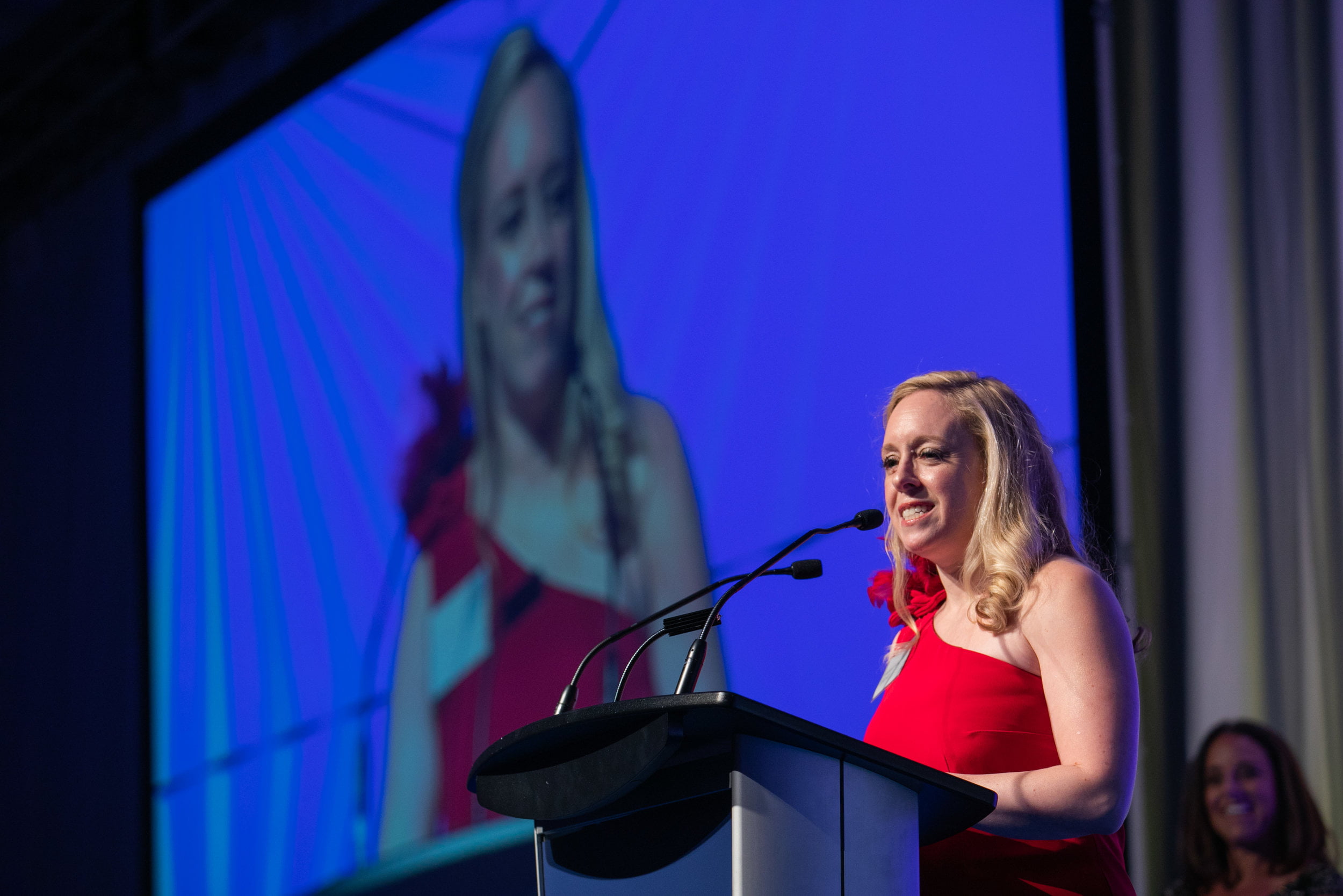 Jennifer Suess speaking at podium